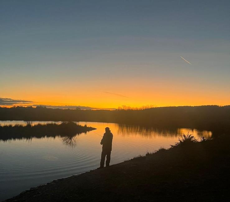 A lone angler enjoys the tranquility at Foxhill